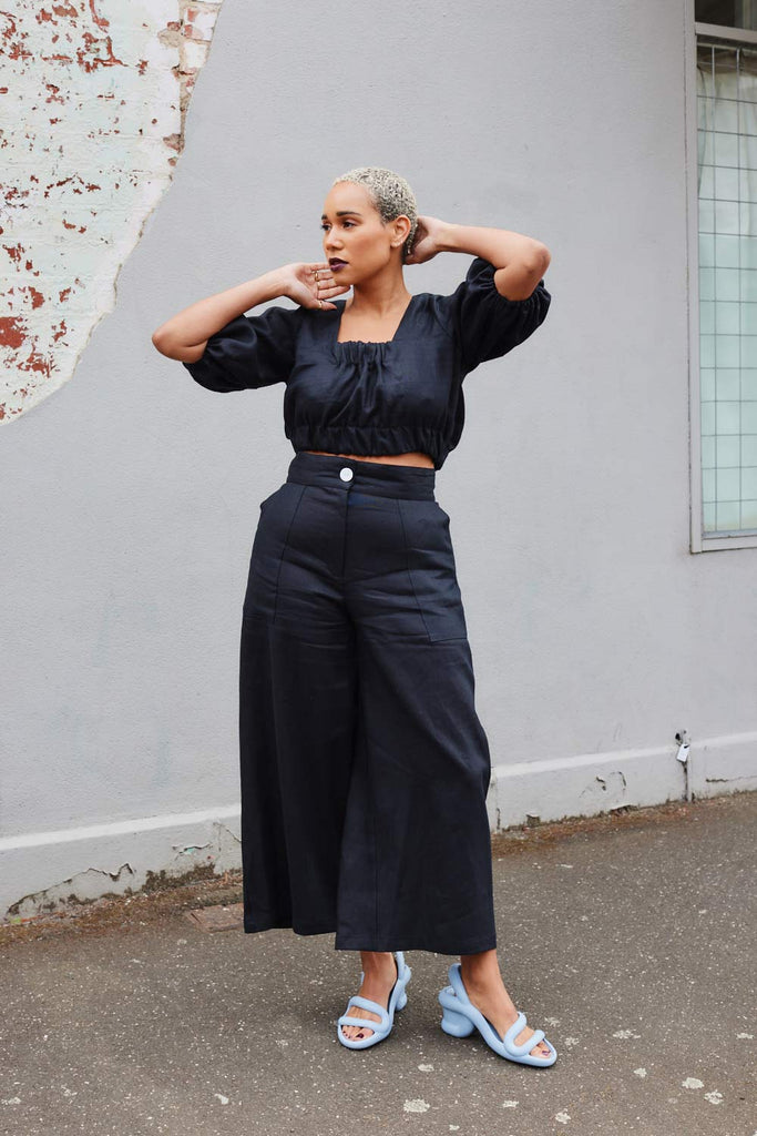 Collective Closets model in high waisted culotte pants