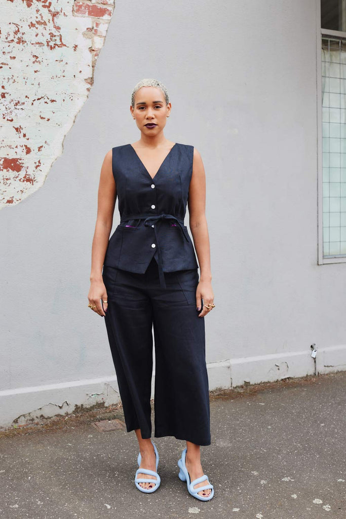 Collective Closets model in culottes and black vest
