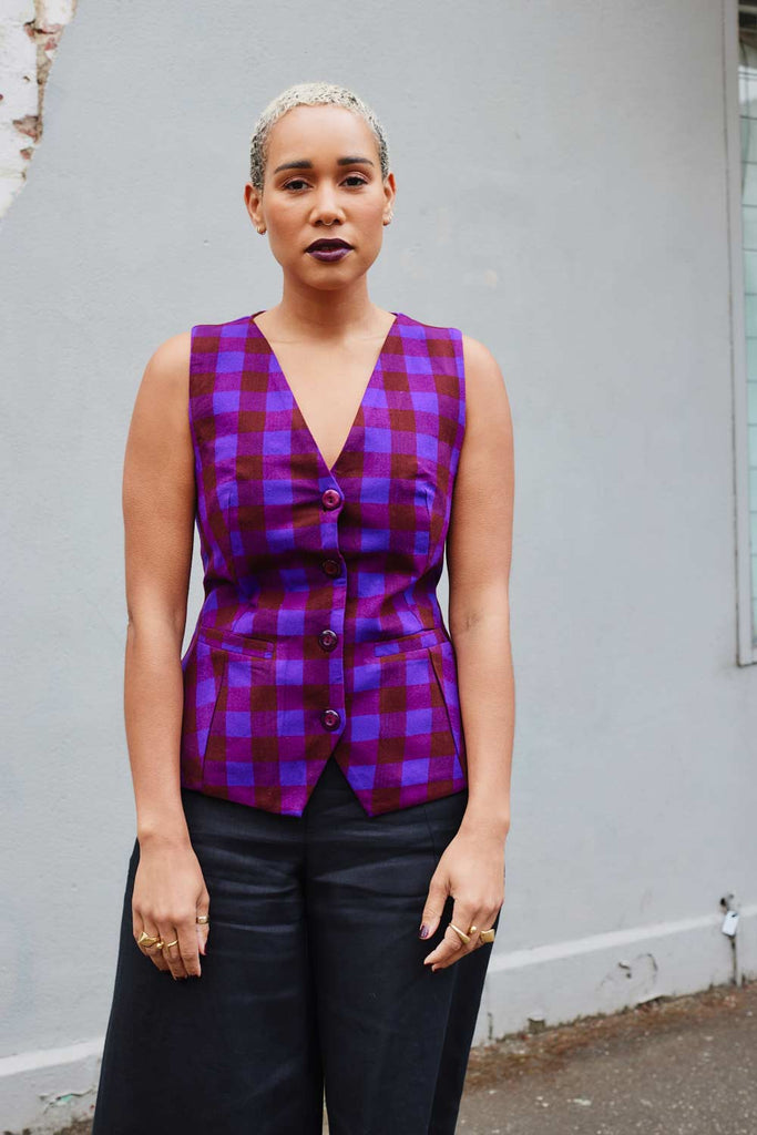 close-up of Collective Closets model in purple plaid vest