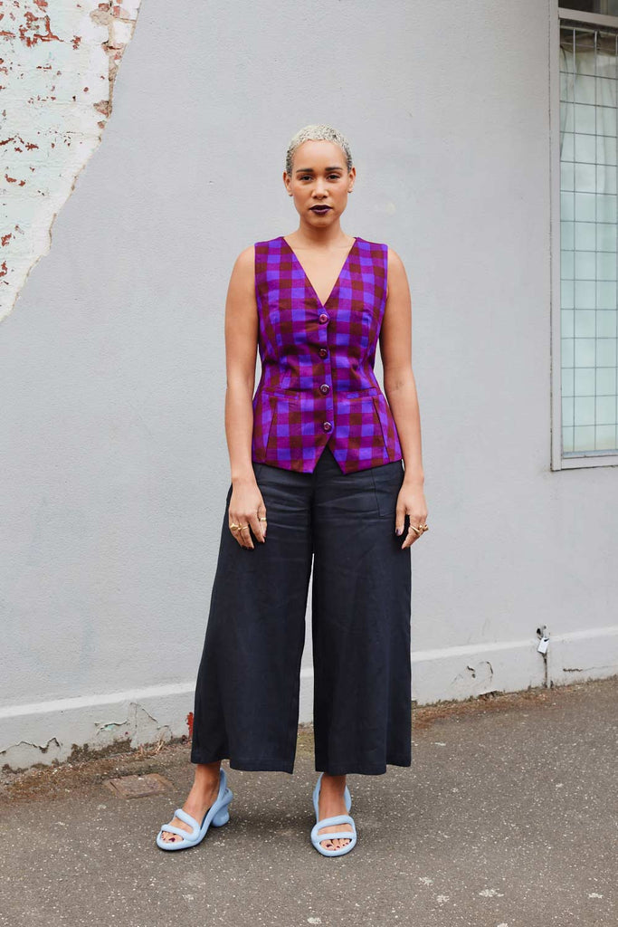 Collective Closets model wears purple checkered vest