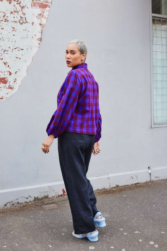 Collective Closets model in purple checkered shirt