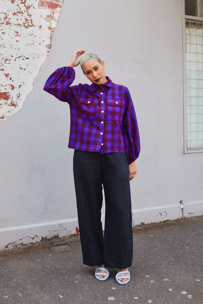 Collective Closets model in purple maximalist print shirt